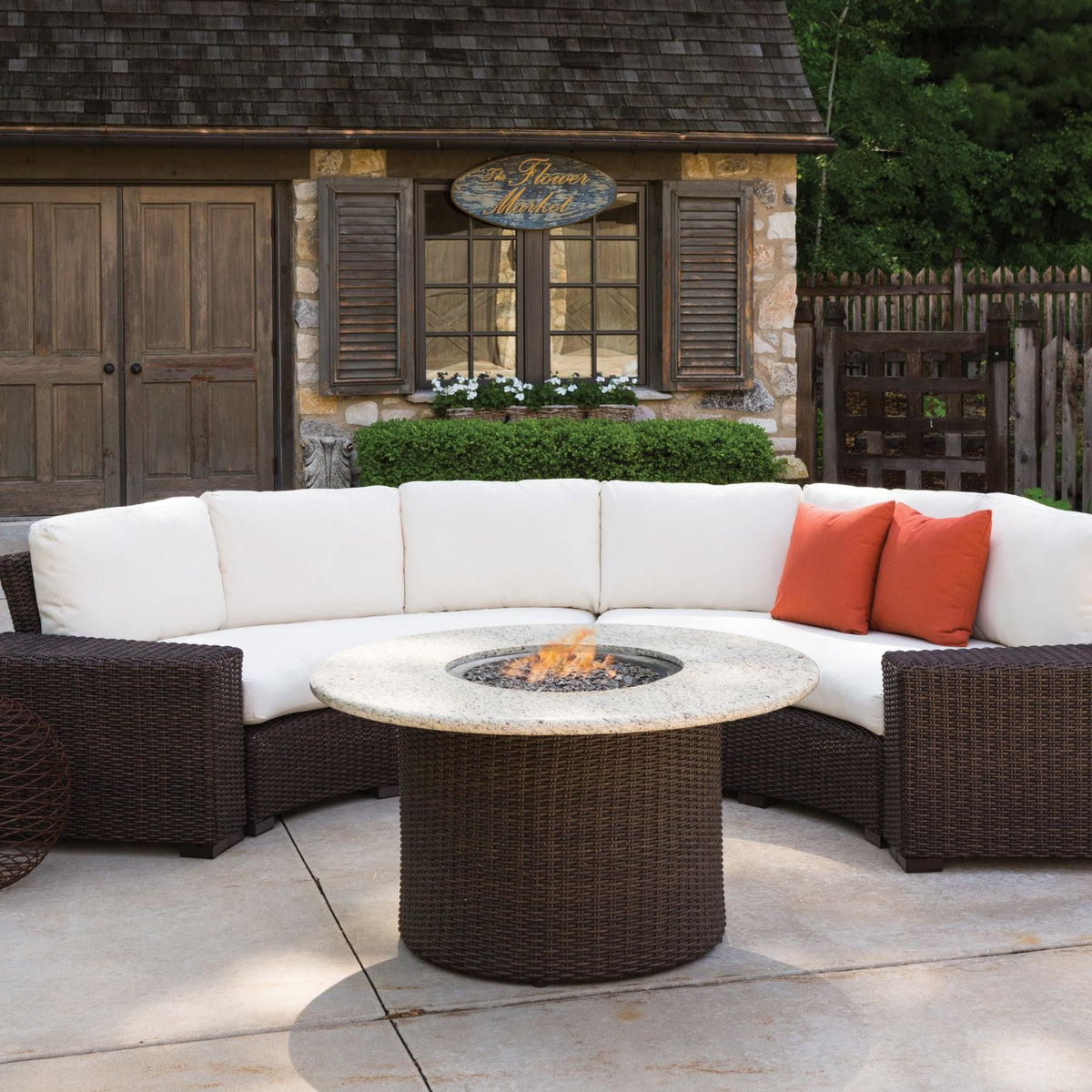 Patio set with fire pit, woven curved couch and round firepit, Riviera Outdoor Decor, Houston, Texas