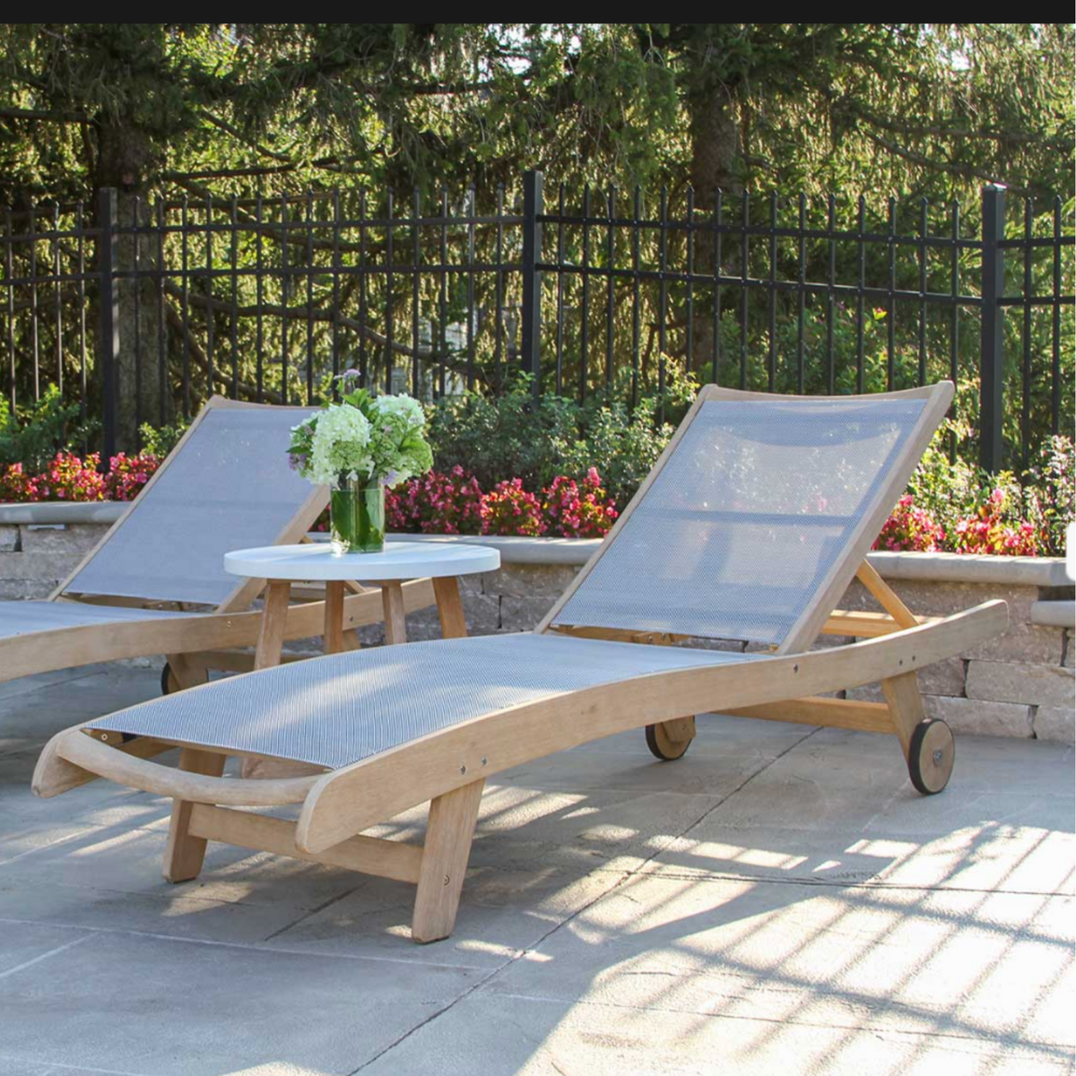   Chaise Lounger offers an extra-wide, Eucalyptus wood with a durable two-toned woven resin fabric