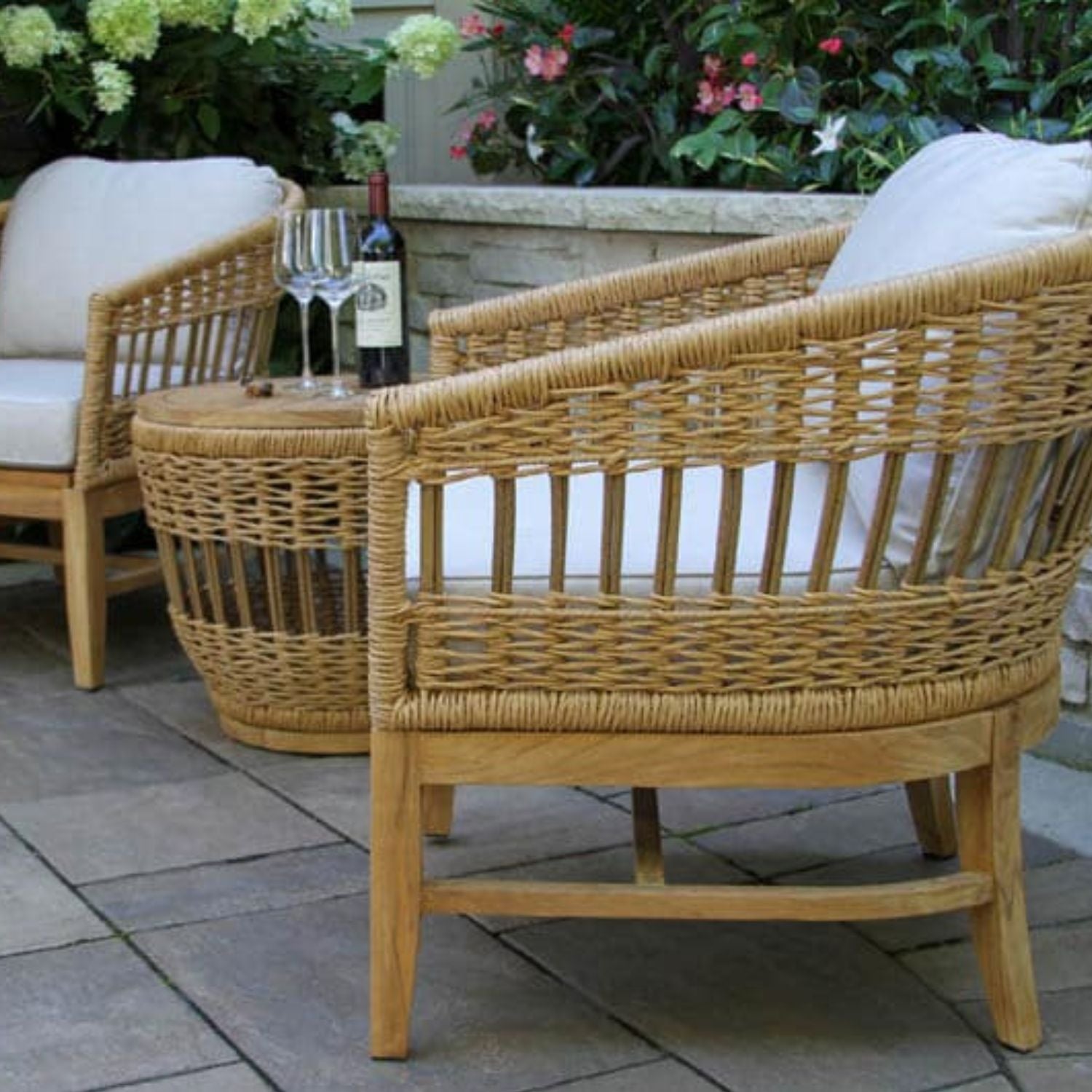 Teak & Wicker patio chairs with Sunbrella cushions, Bohemian style. Riviera Outdoor Decor