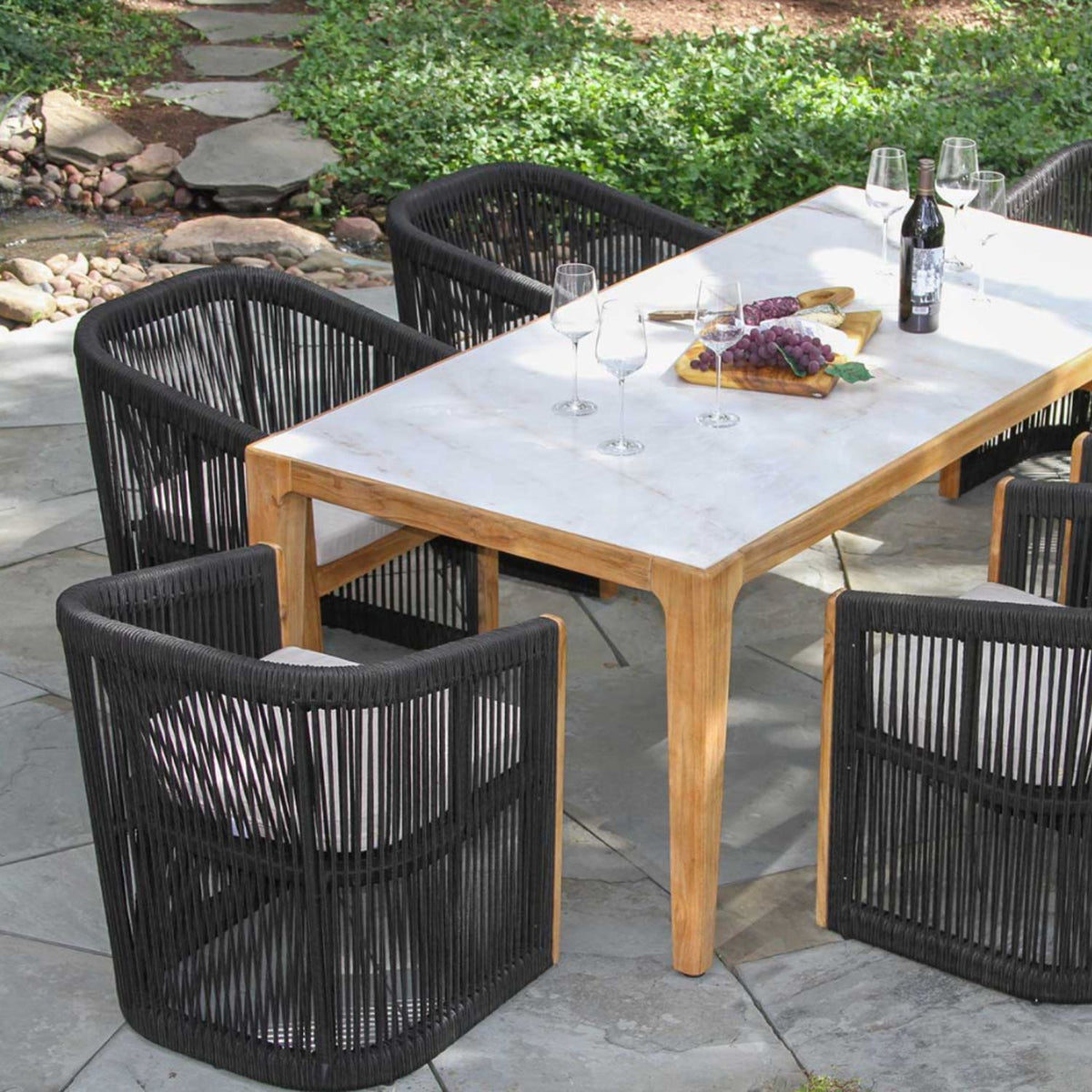Outdoor dining set, nautical black rope chairs and sintered stone table top